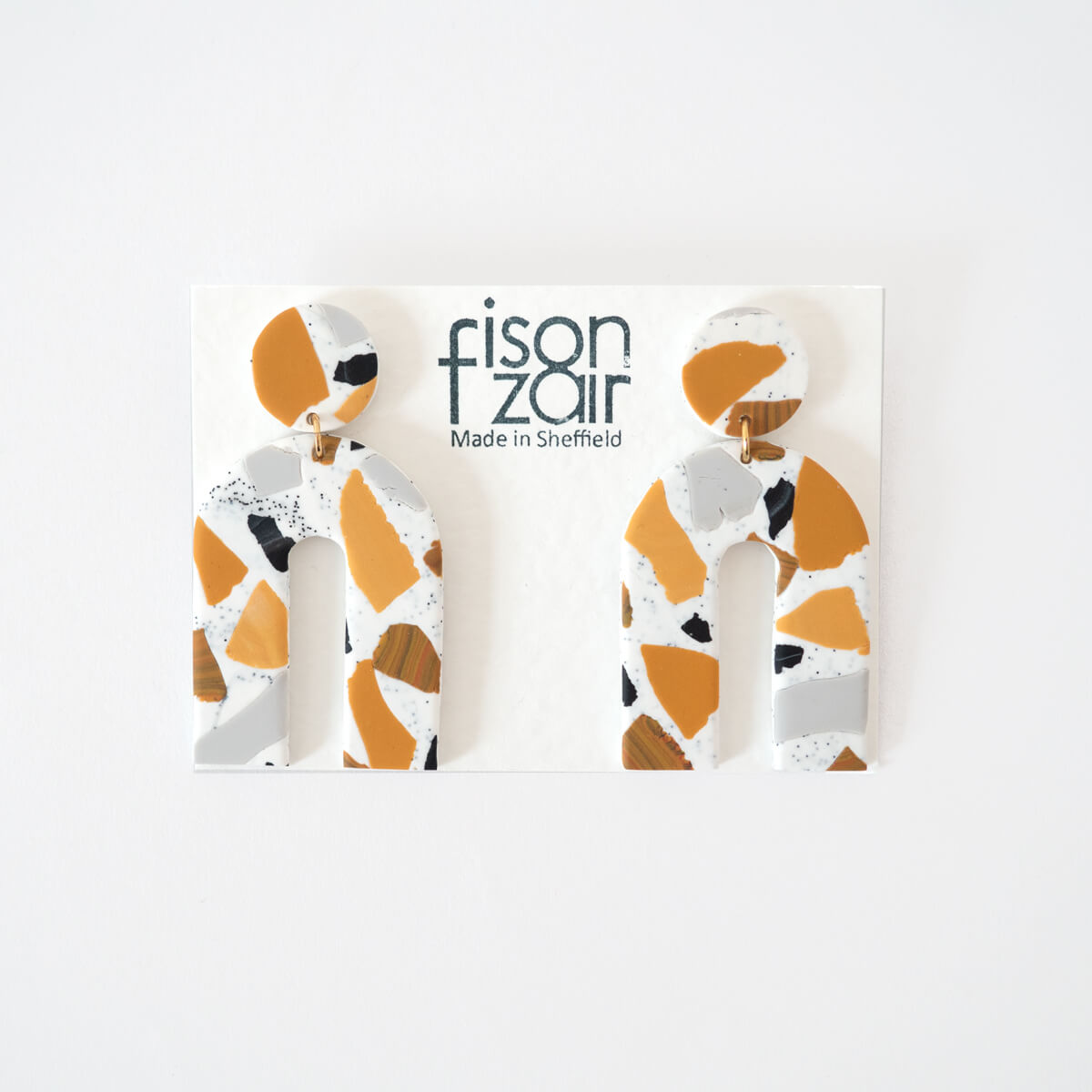 Large statement Terrazzo Arch Earrings in Mustard, black and white by Fison Zair