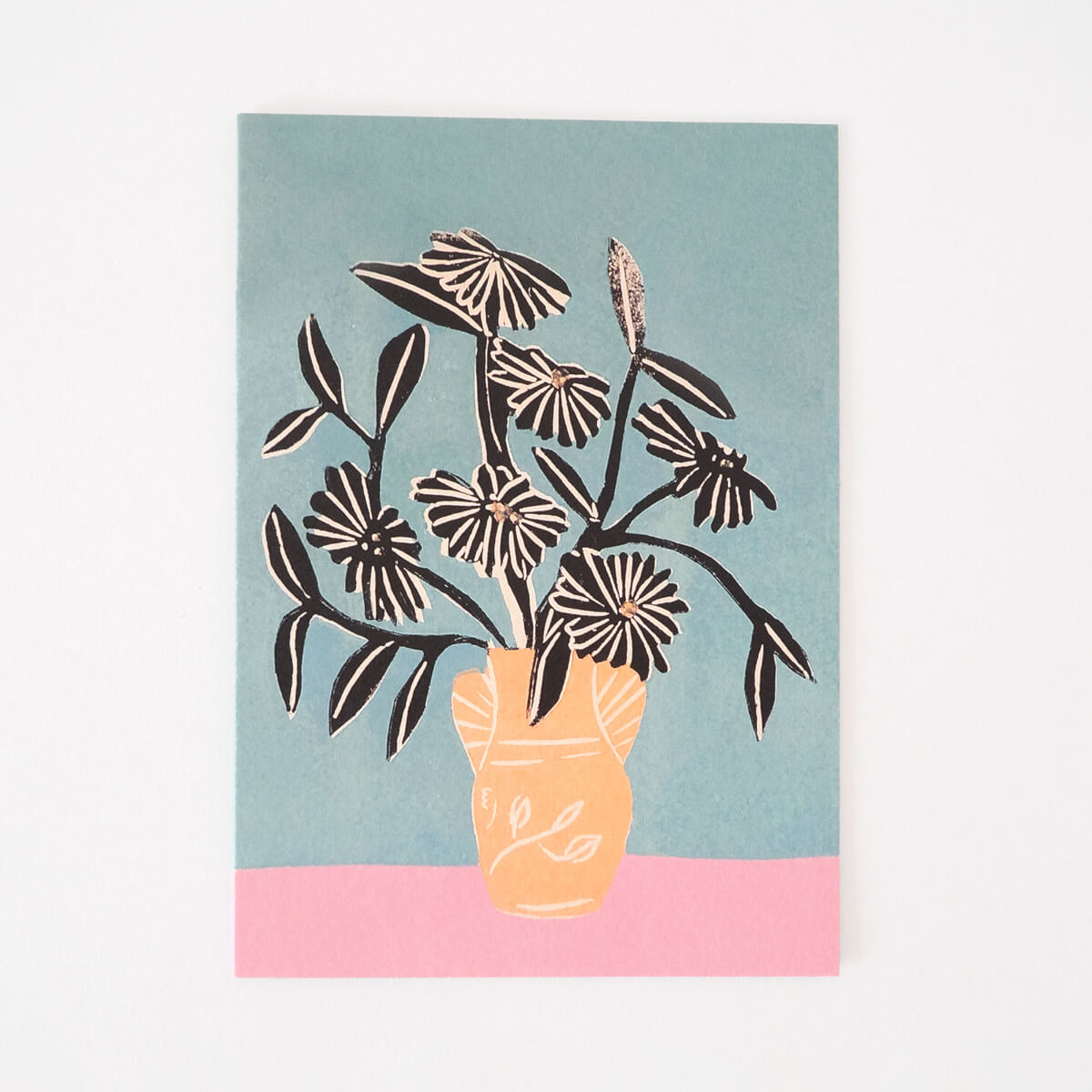 Greeting card featuring beautiful blooms in a peachy vase.
