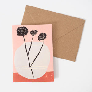 Still life of three flowers in a wonky vase greeting card with brown kraft envelope