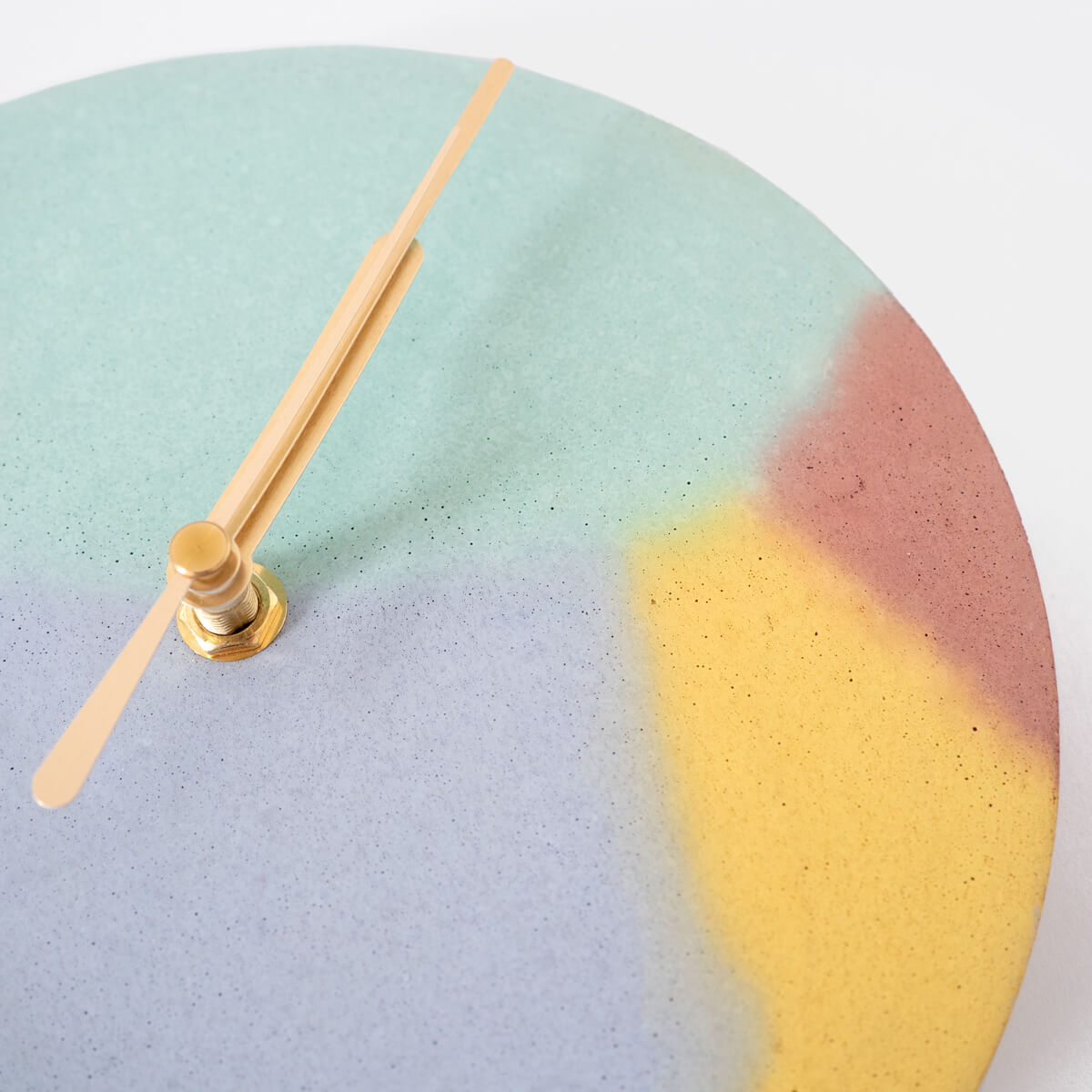 Close up to show the smooth texture and colours of the clock face.