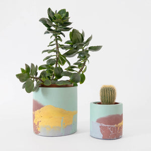 Image showing the two available concrete planter sizes in the yellow and mint colourway.