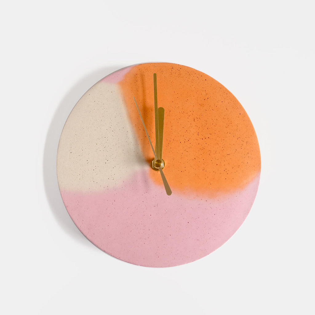Pink and orange round concrete wall clock by Studio Emma for Curious Makers